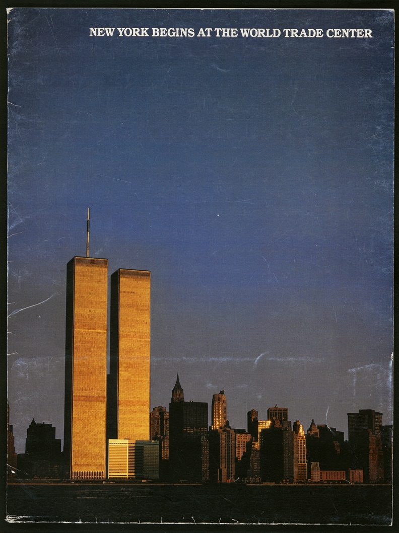 Color photograph of lower Manhattan with Twin Towers glowing with golden sunlight and dominating the grey-blue sky. White text on top reads: "New York Begins at the World Trade Center."